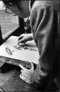 Dali works at a lithography stone in the Atelier Mourlot by Salvador Dal&iacute;