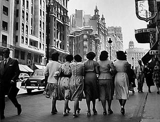 Ladies Walking Along Gran V&iacute;a, Madrid, Spain. by Francesc Catal&aacute; Roca