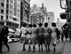 Ladies Walking Along Gran V&iacute;a, Madrid, Spain. by Francesc Catal&aacute; Roca